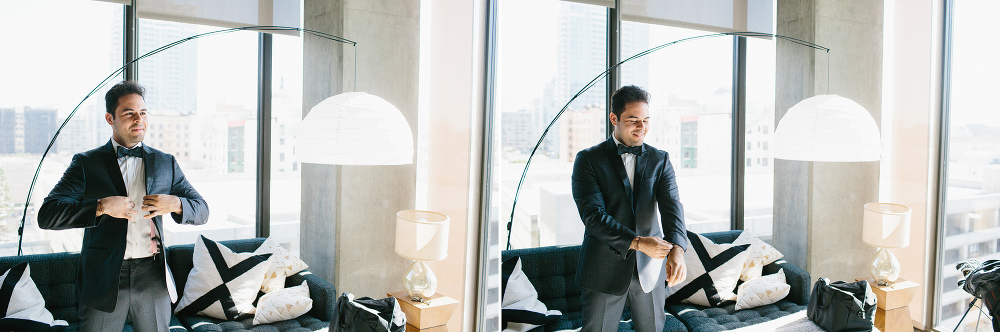 The groom getting dressed. 