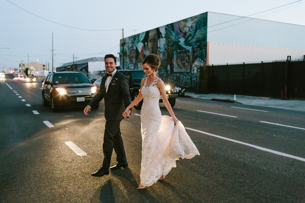 The couple crossing the street. 