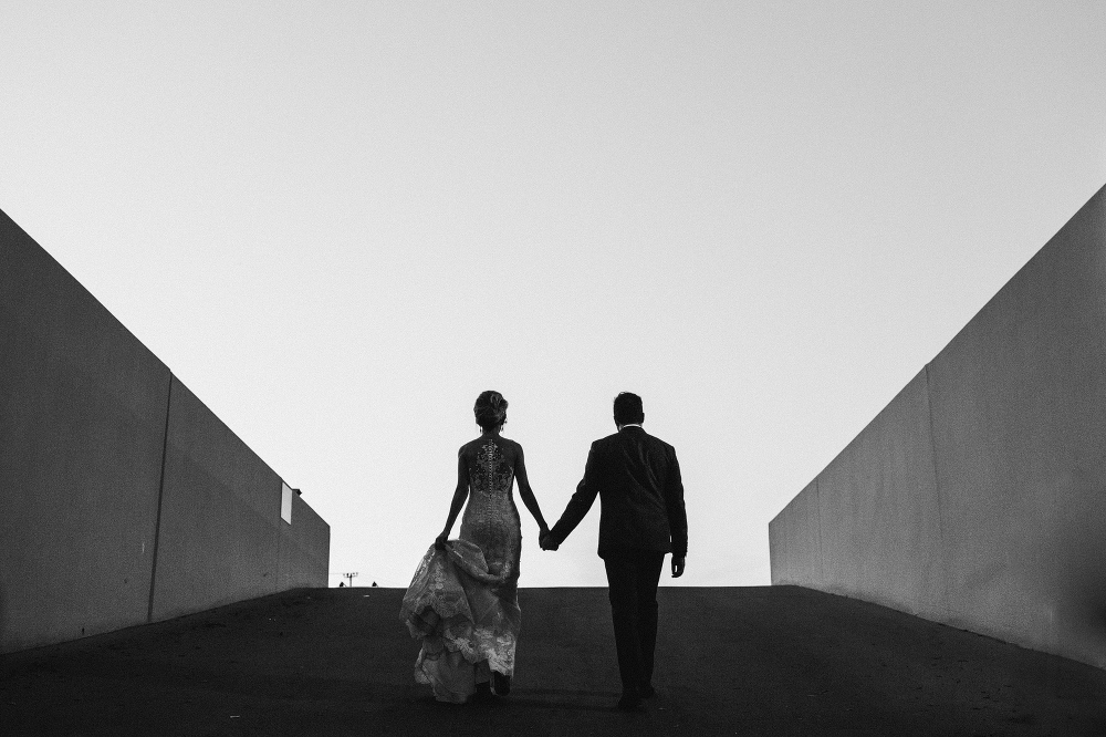 Ashley and Luis walking to the top of a parking garage. 