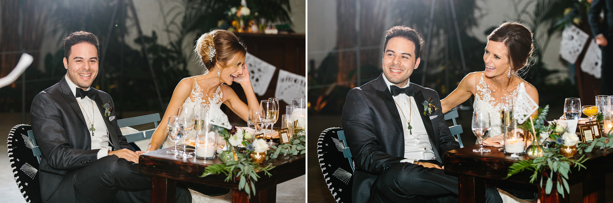 The bride and groom laughing during a toast. 