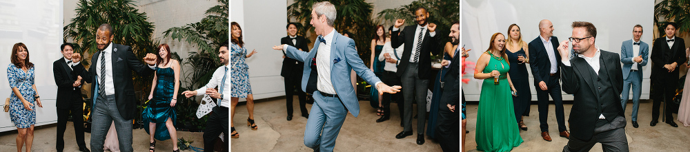 Guests dancing in the center of a circle. 