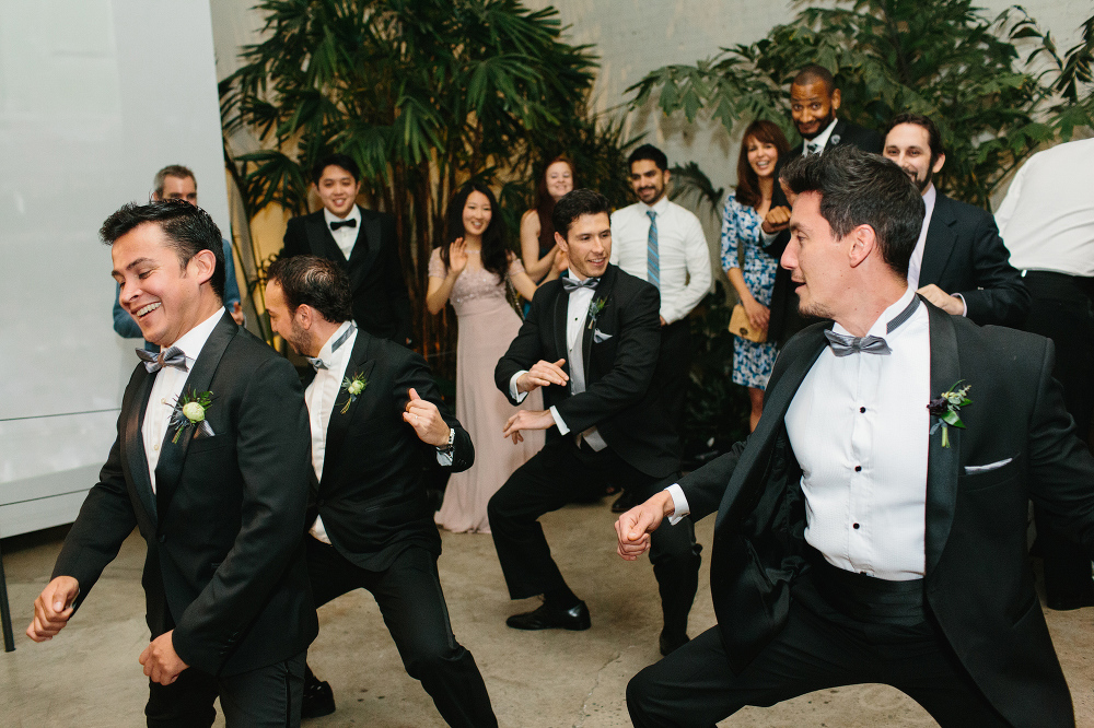 The groomsmen dancing together. 
