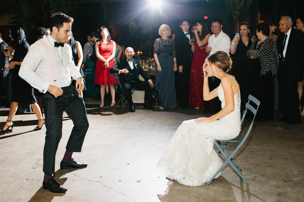 Luis dancing in front of Ashley. 