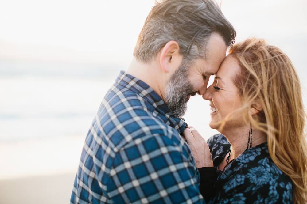 The couple laughing together. 