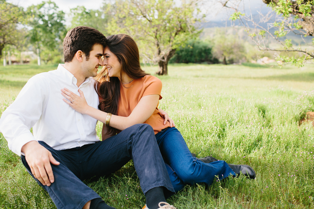 A sweet photo of the couple sitting together. 