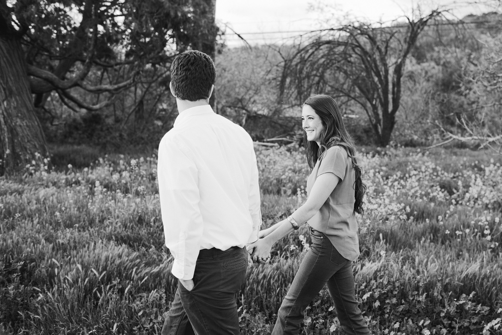 The couple walking in the fields. 