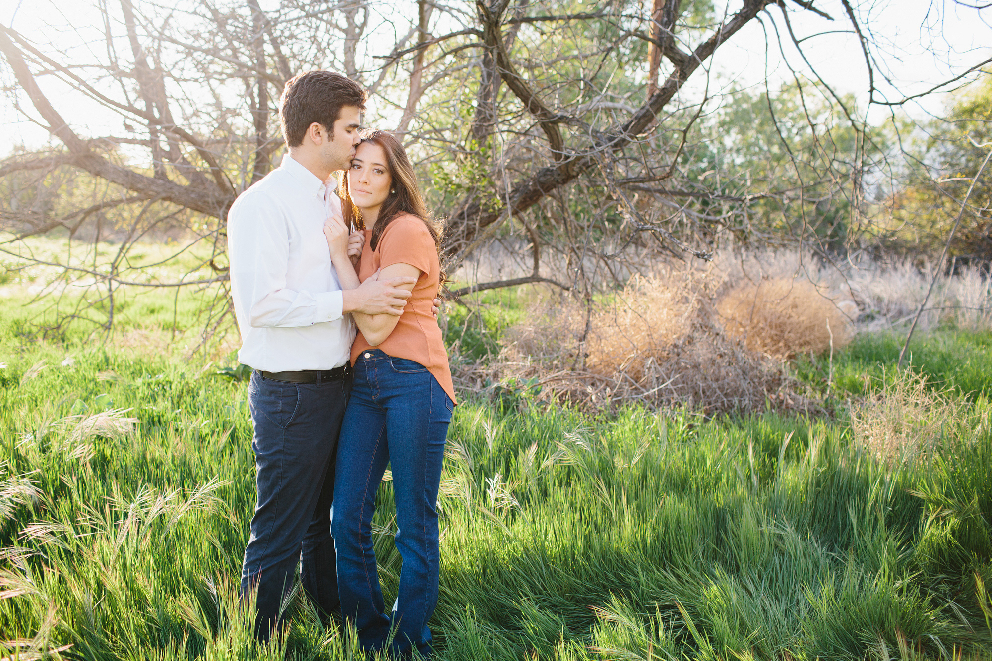 Rosario and Charlie in a green field. 