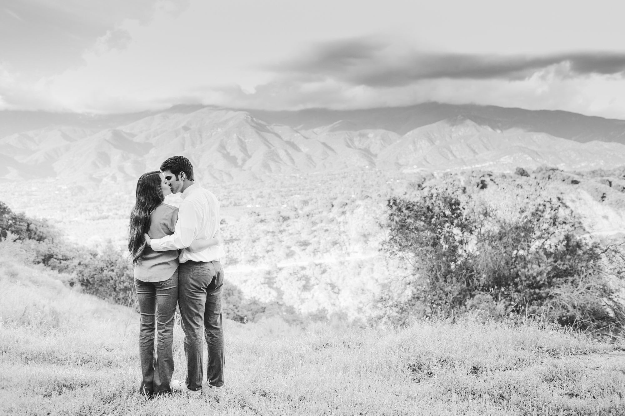 A gorgeous black and white photo of the couple on the mountain. 