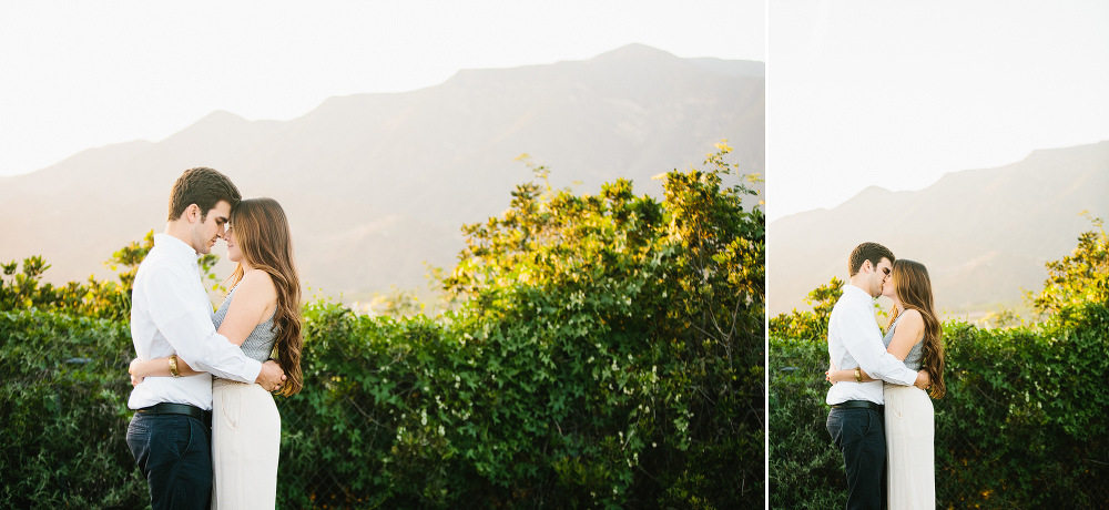 The couple in front of an orchard. 