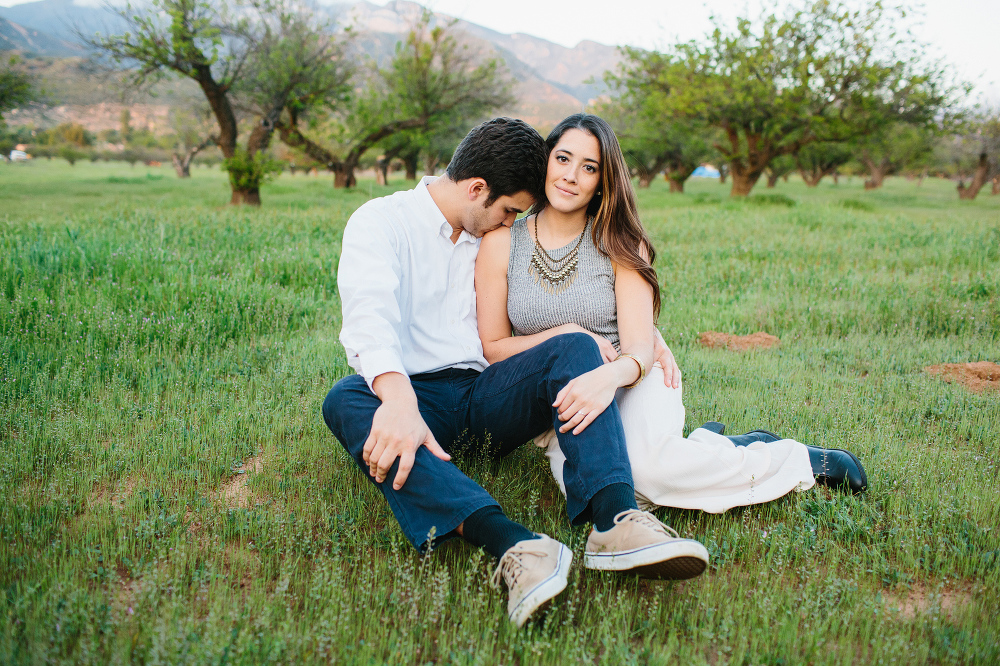 Rosario and Charlie sitting in the grass. 