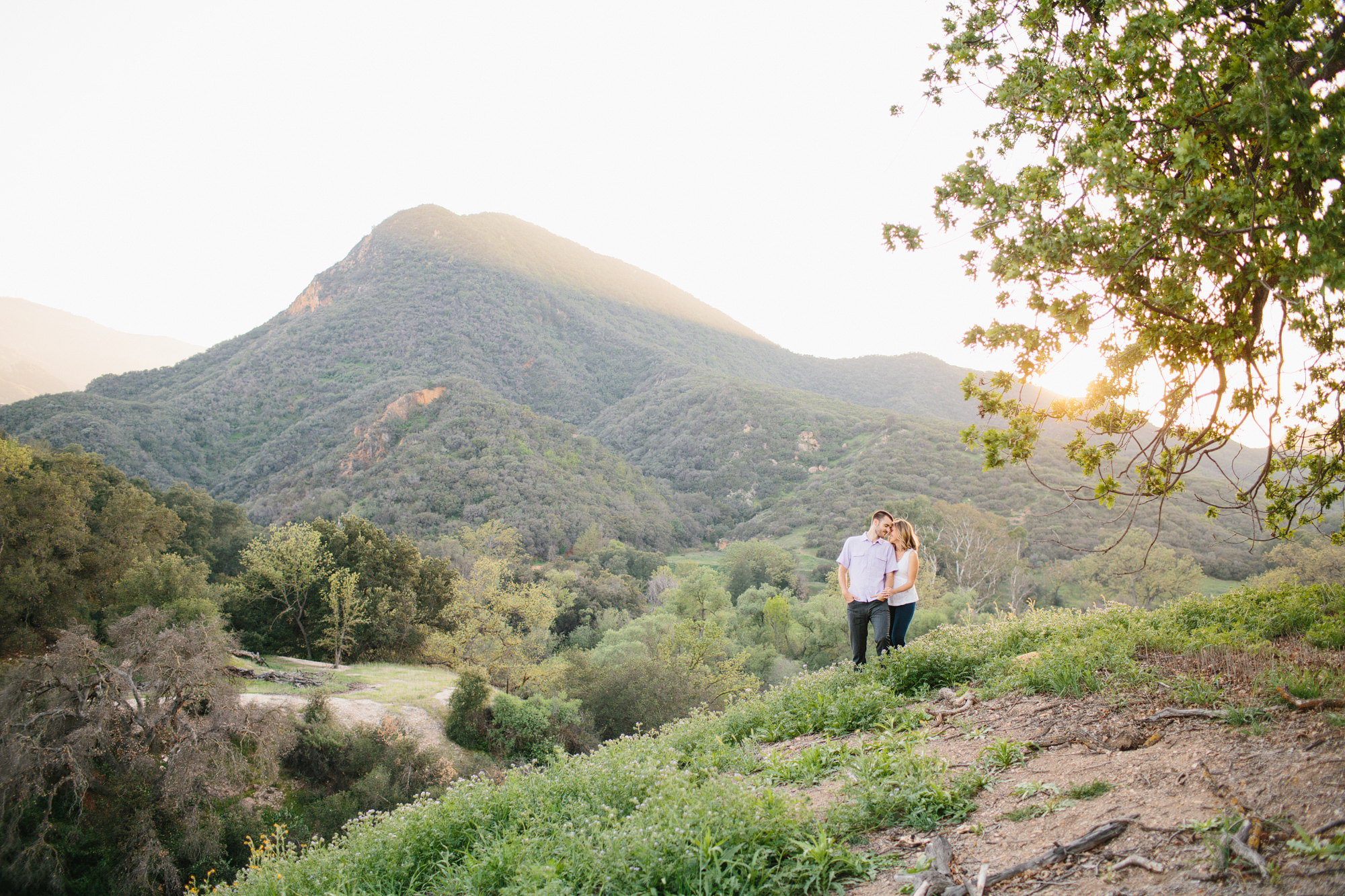 The couple with mountains in the background. 