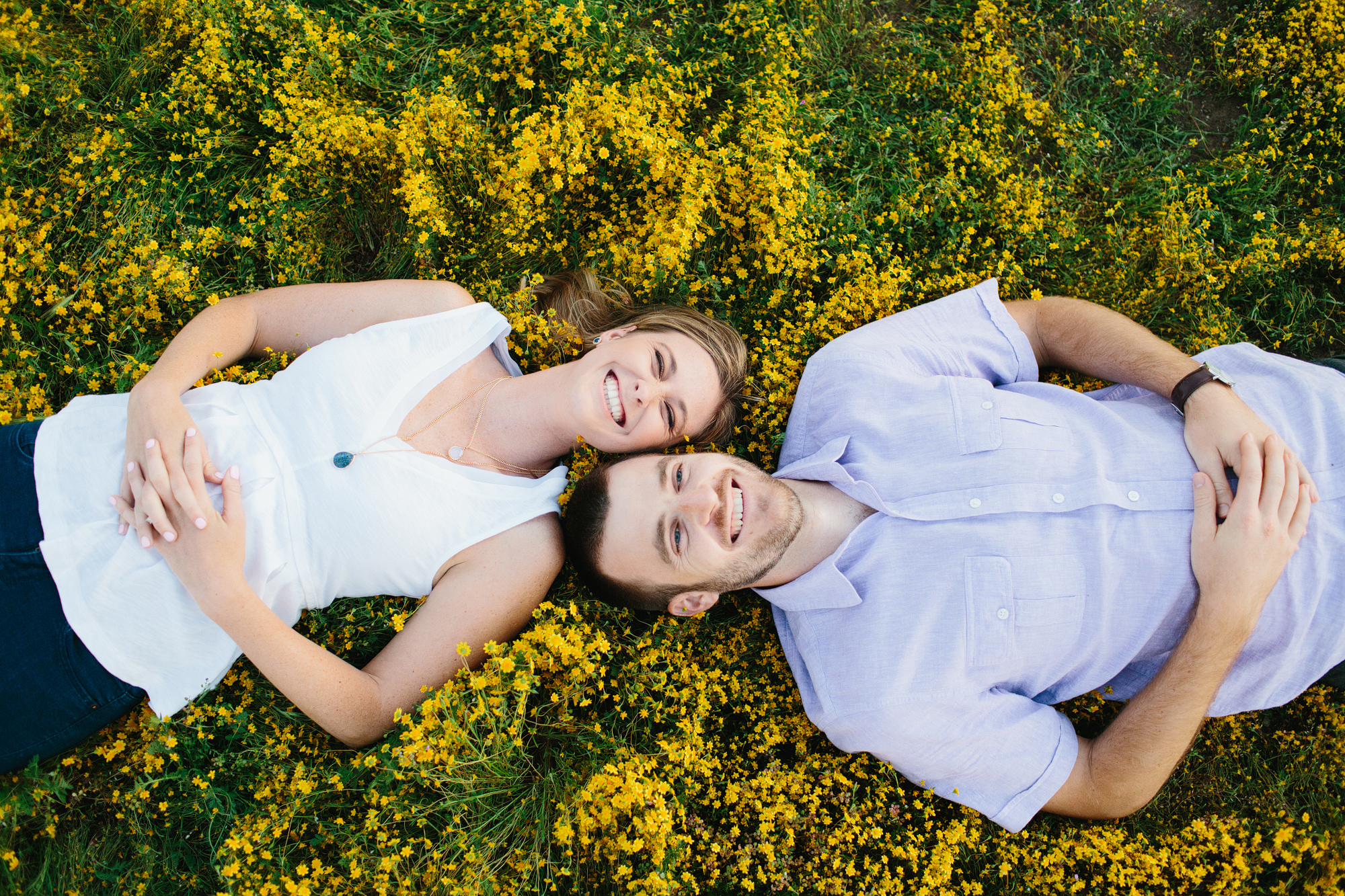 Kara and Sean laying on the ground. 